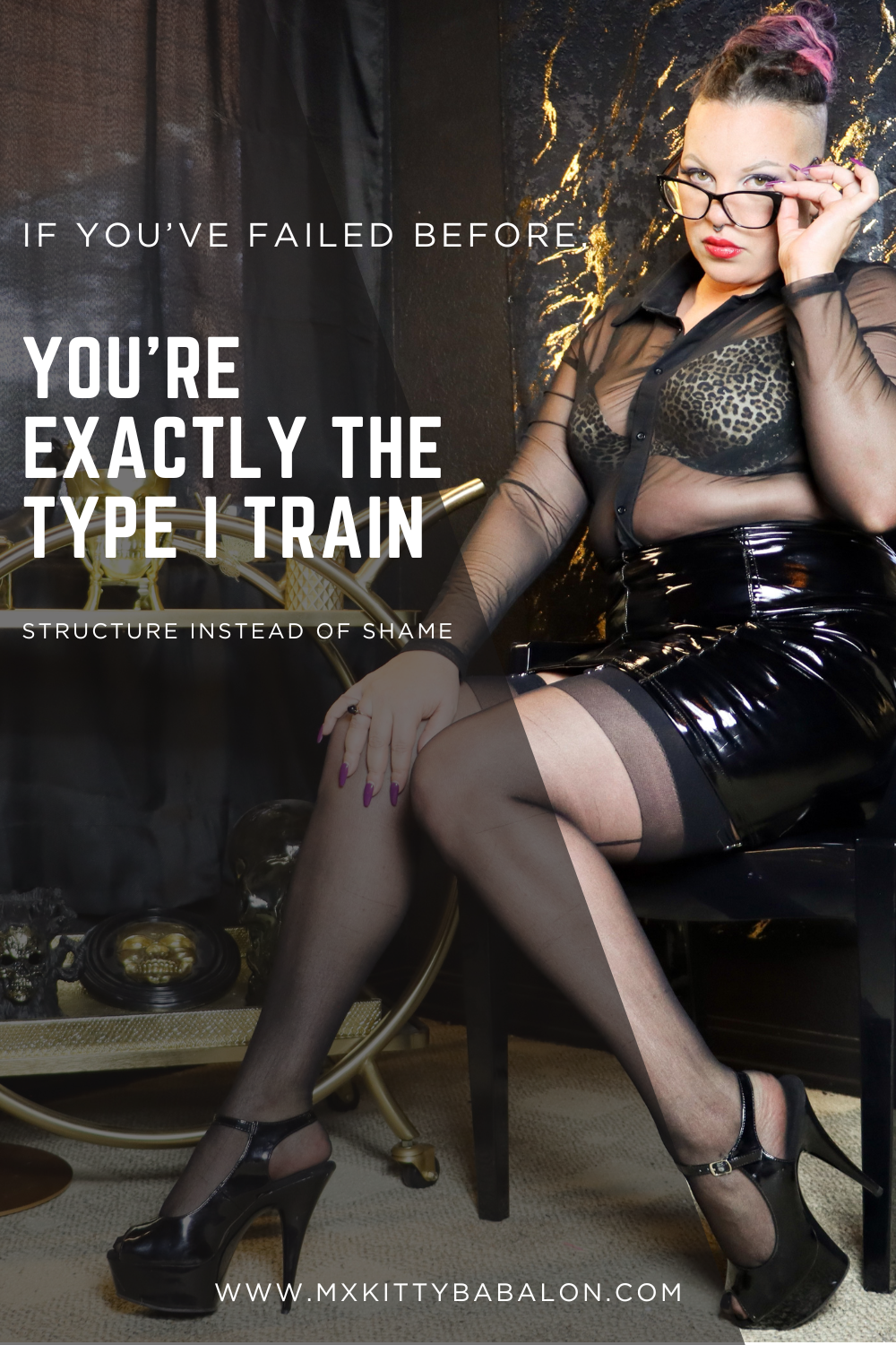 Mx Babalon seated confidently, wearing glasses and black attire, conveying calm discipline and authority