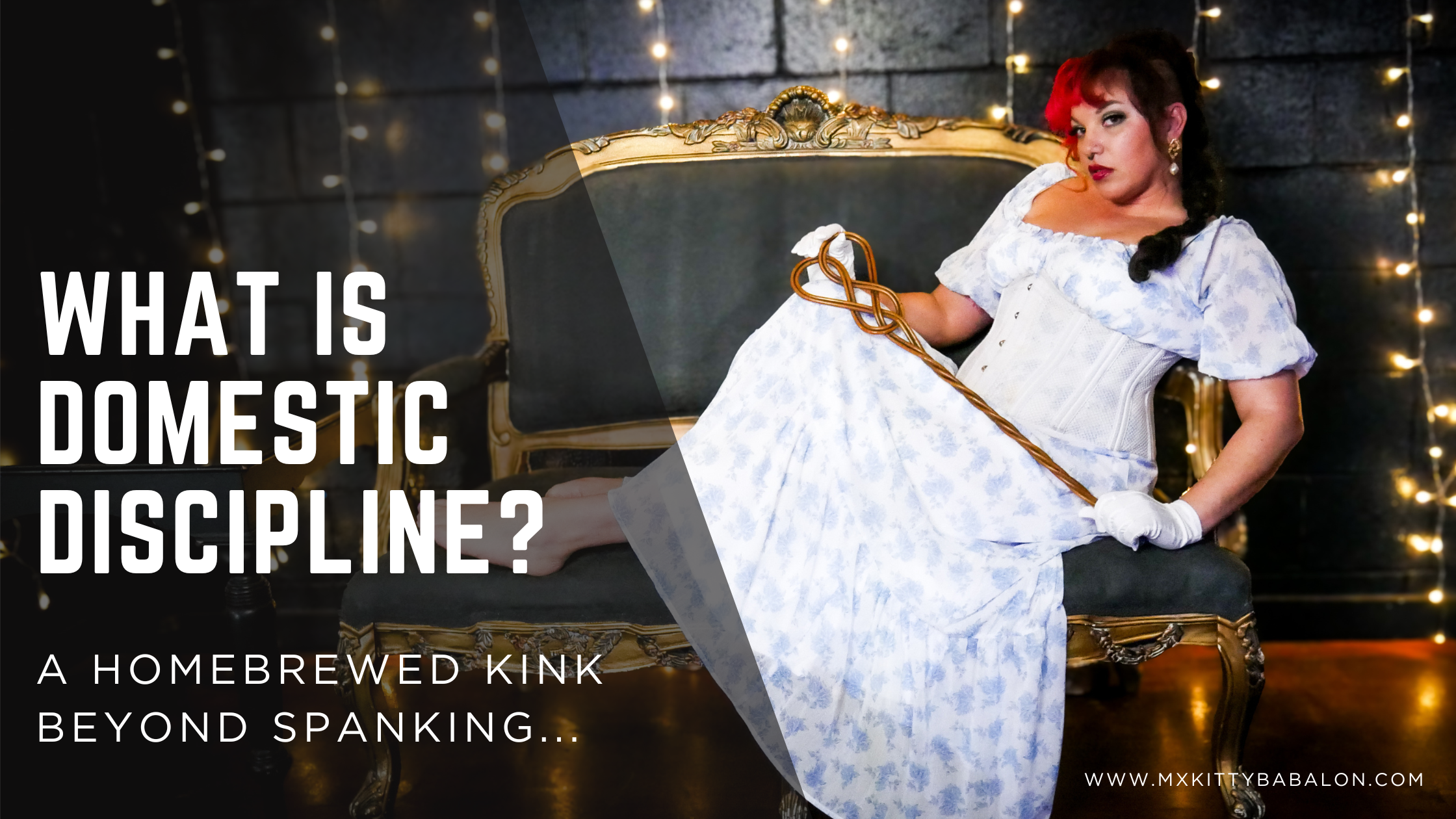 Mx Babalon poses in a white dress and gloves on a Victorian coach holding an antique rug beater. Graphics say "What is Domestic Discipline? A Homebrewed Kink Beyond Spanking"